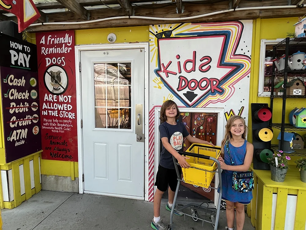 Minnesota's Largest Candy Store - Kids about to walk through the Kid's door with kid sized shopping carts