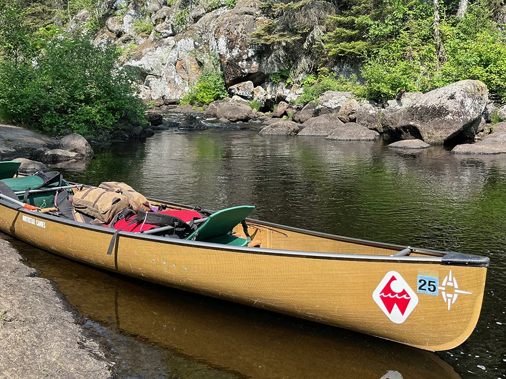 Best Canoe Seats - Crazy Creek Canoe Seat III in a fully loaded canoe and folded down for ease of portaging