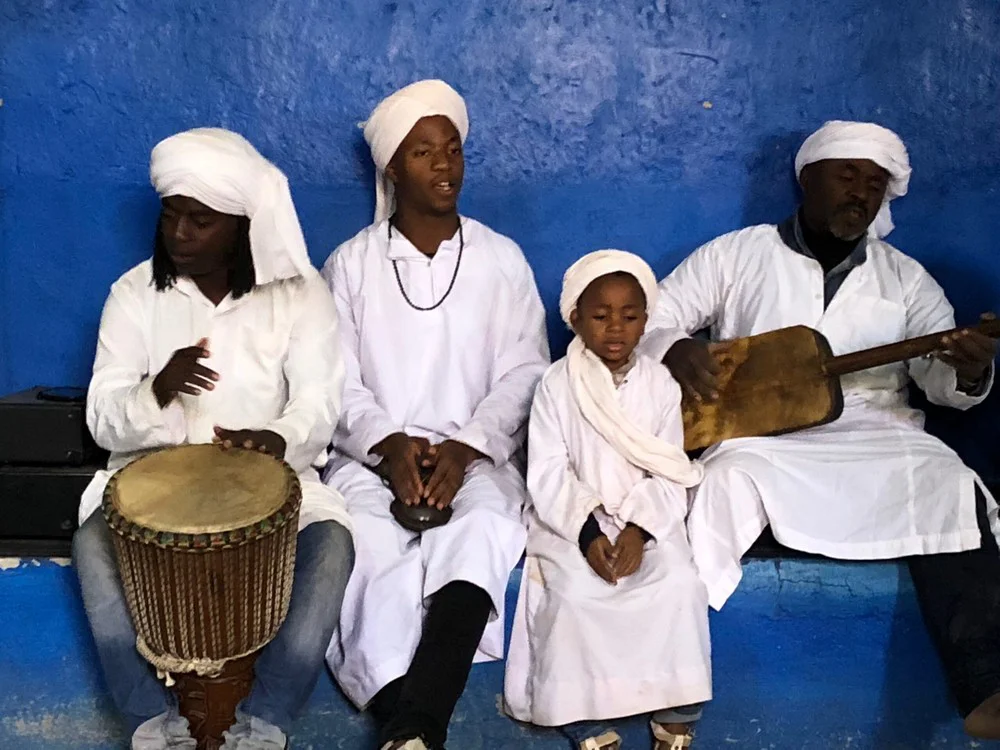Fes to Marrakech Desert Tour - Men playing traditional Gnaoua music