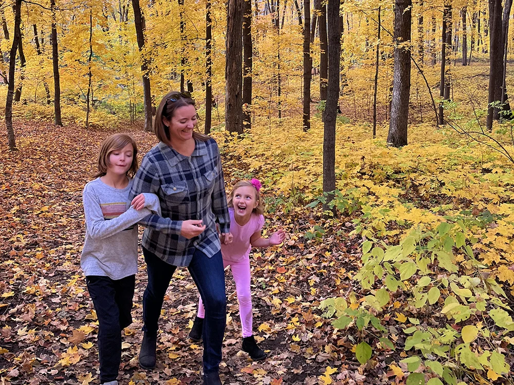 Sustainable Sweaters - Mom walking with her kids wearing her Abode Outside Lakeside flannel
